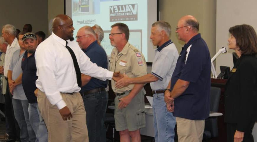 Men shaking hands after graduation